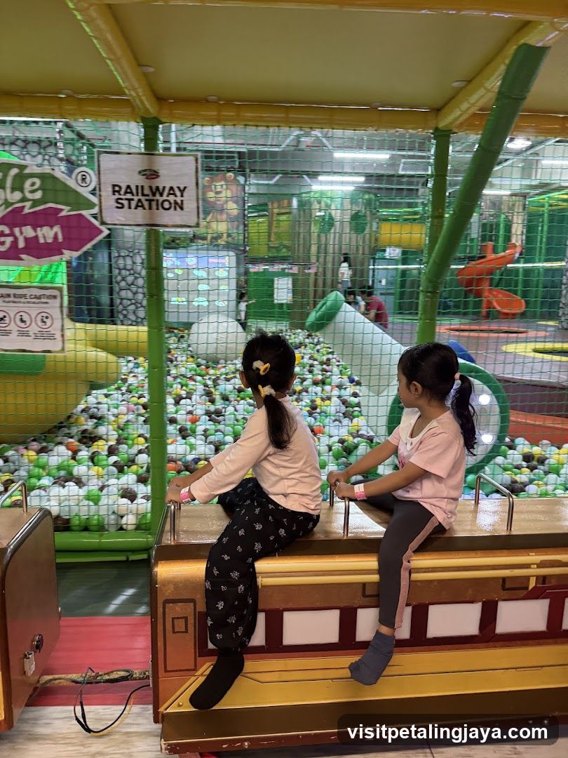 Children on a train ride at a play center