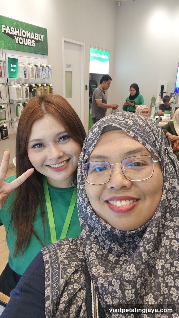 Two women smiling for a selfie in a store