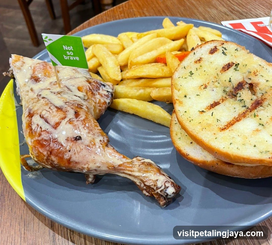 Chicken meal with fries and garlic bread