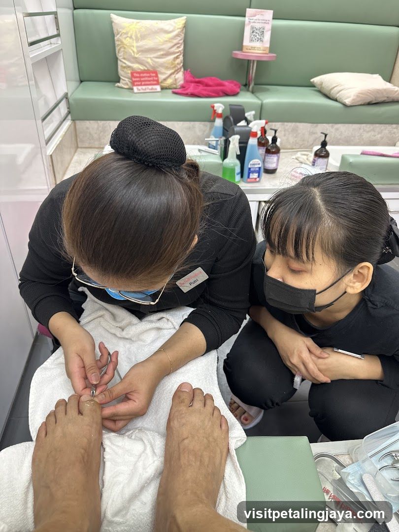 Nail Technicians Performing Pedicure