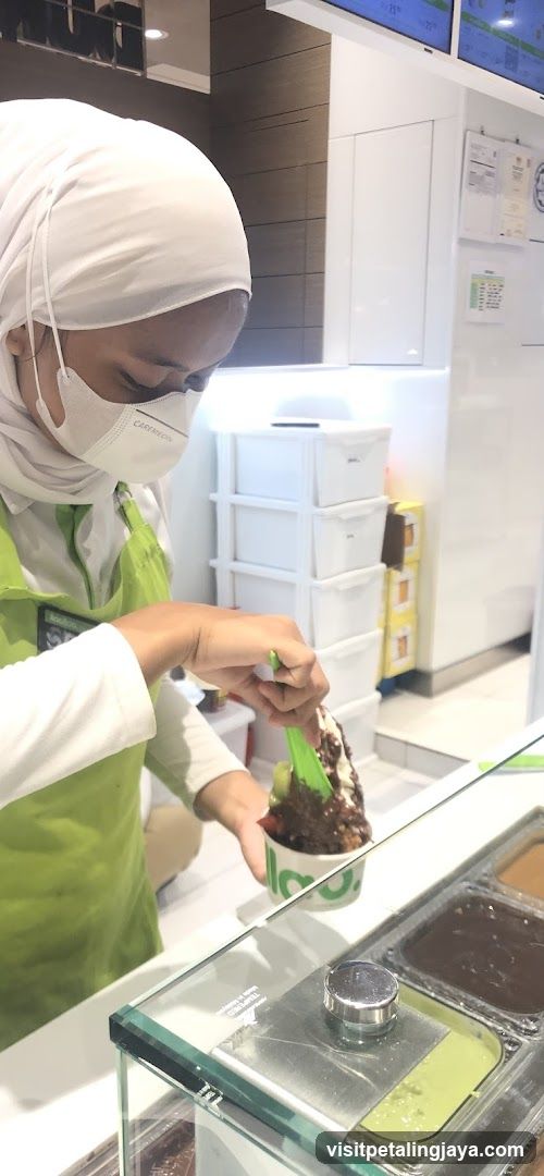 Staff preparing shaved ice dessert