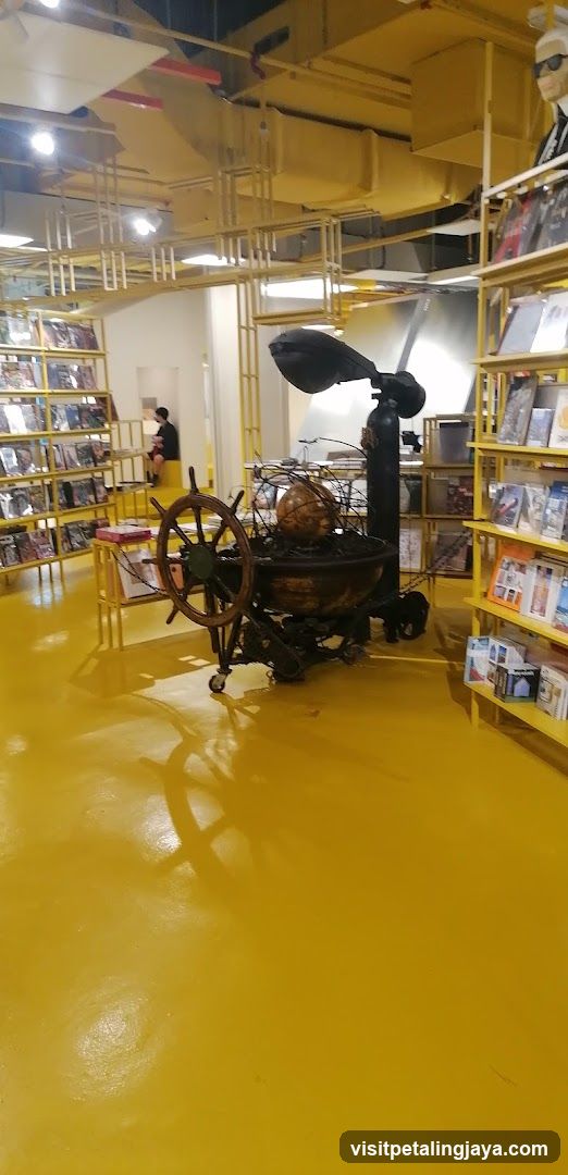 Interior of a bookstore with yellow decor