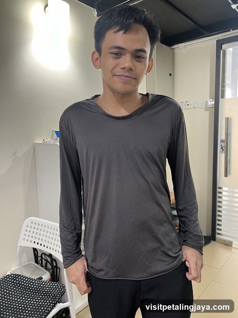 Man in a dark grey long-sleeved shirt