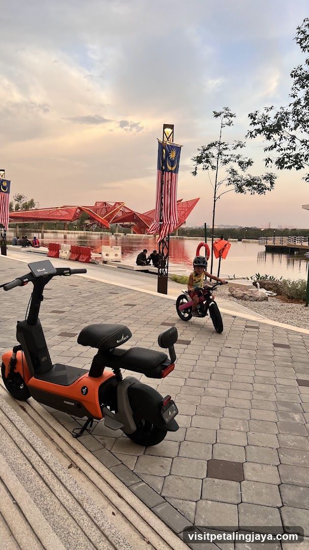 Park Scene with Scooters and Flags