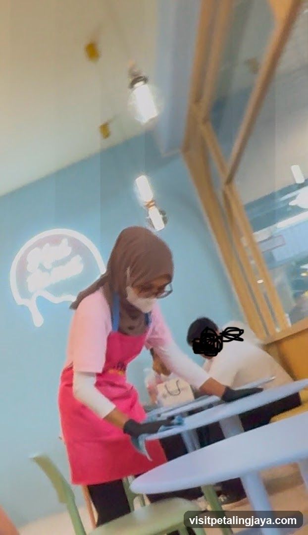Staff cleaning tables