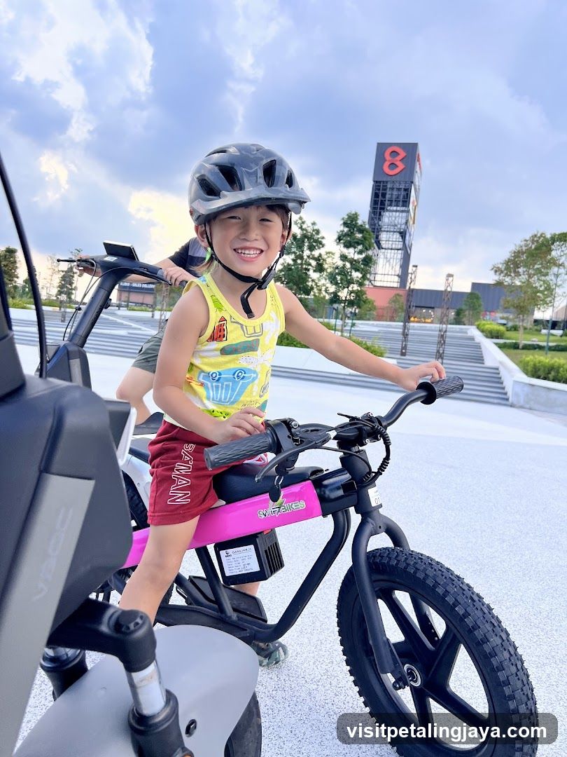 Boy on a pink electric bike