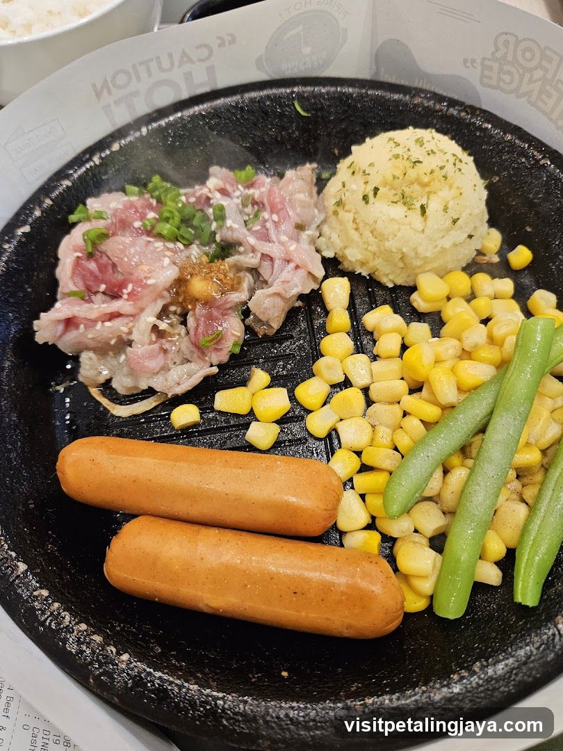 Sizzling Platter with Beef, Sausages, and Sides