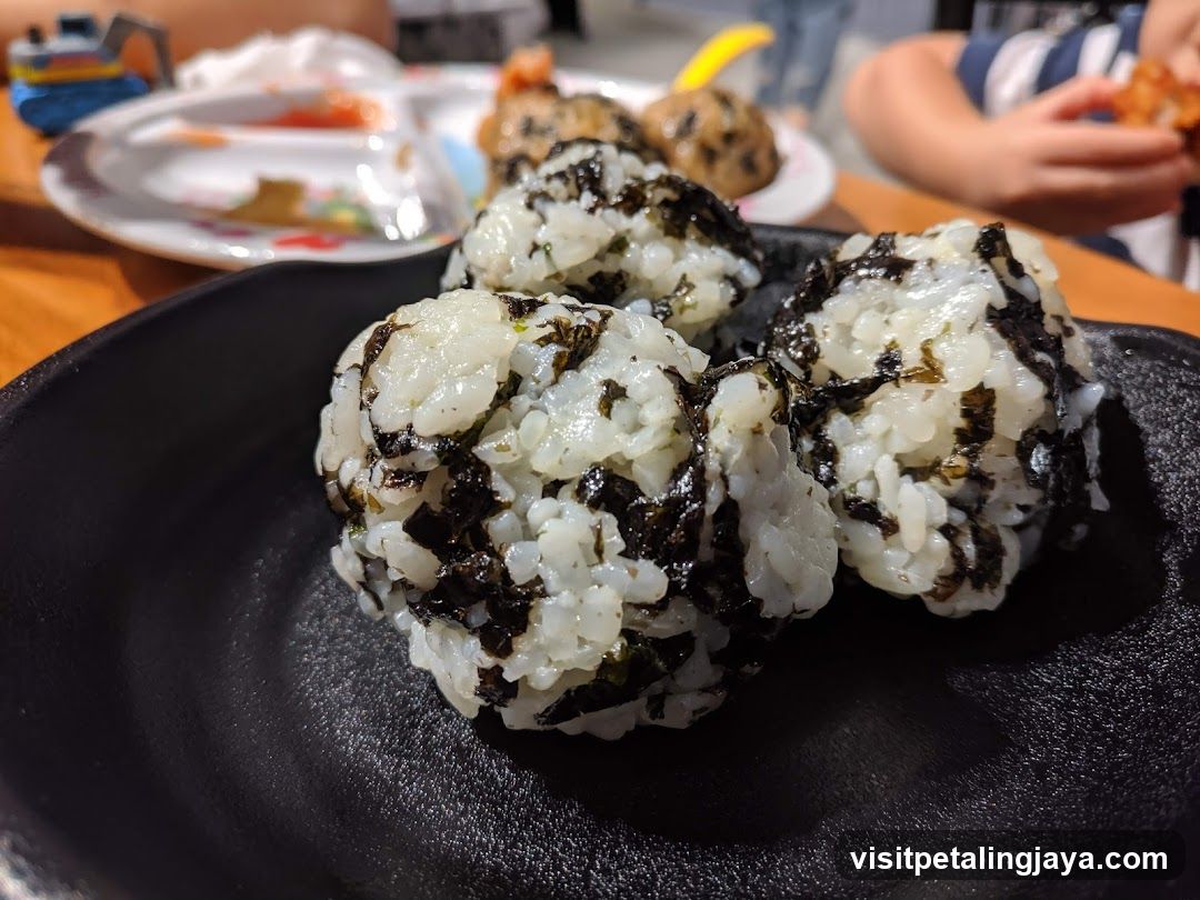 Onigiri on a black plate