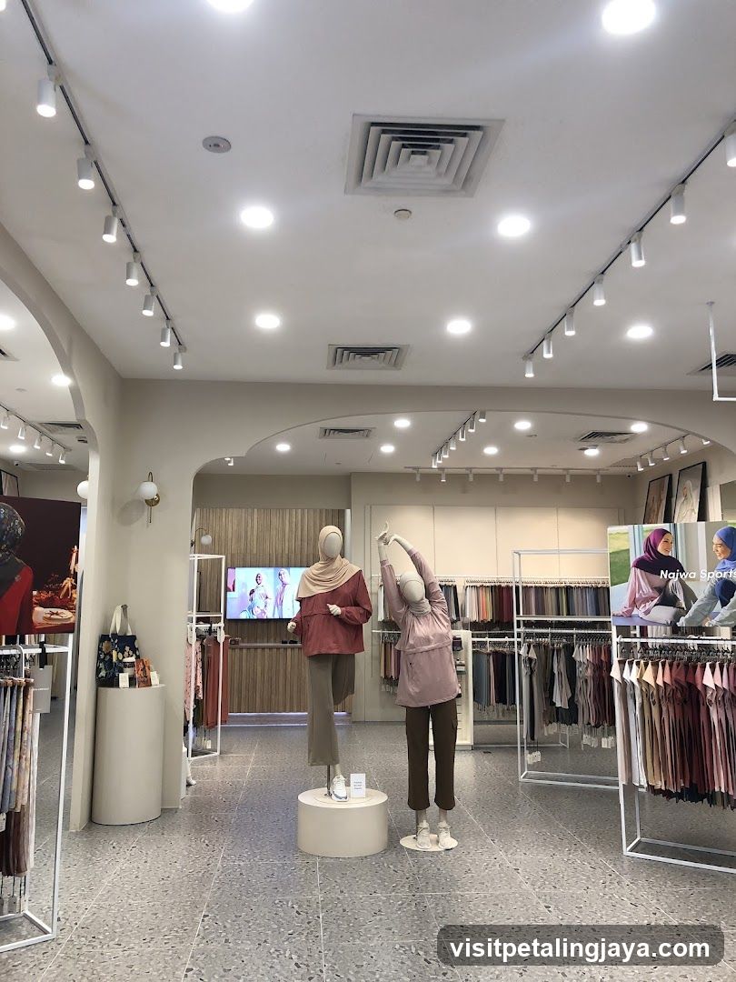 Clothing store interior with mannequins and apparel displays