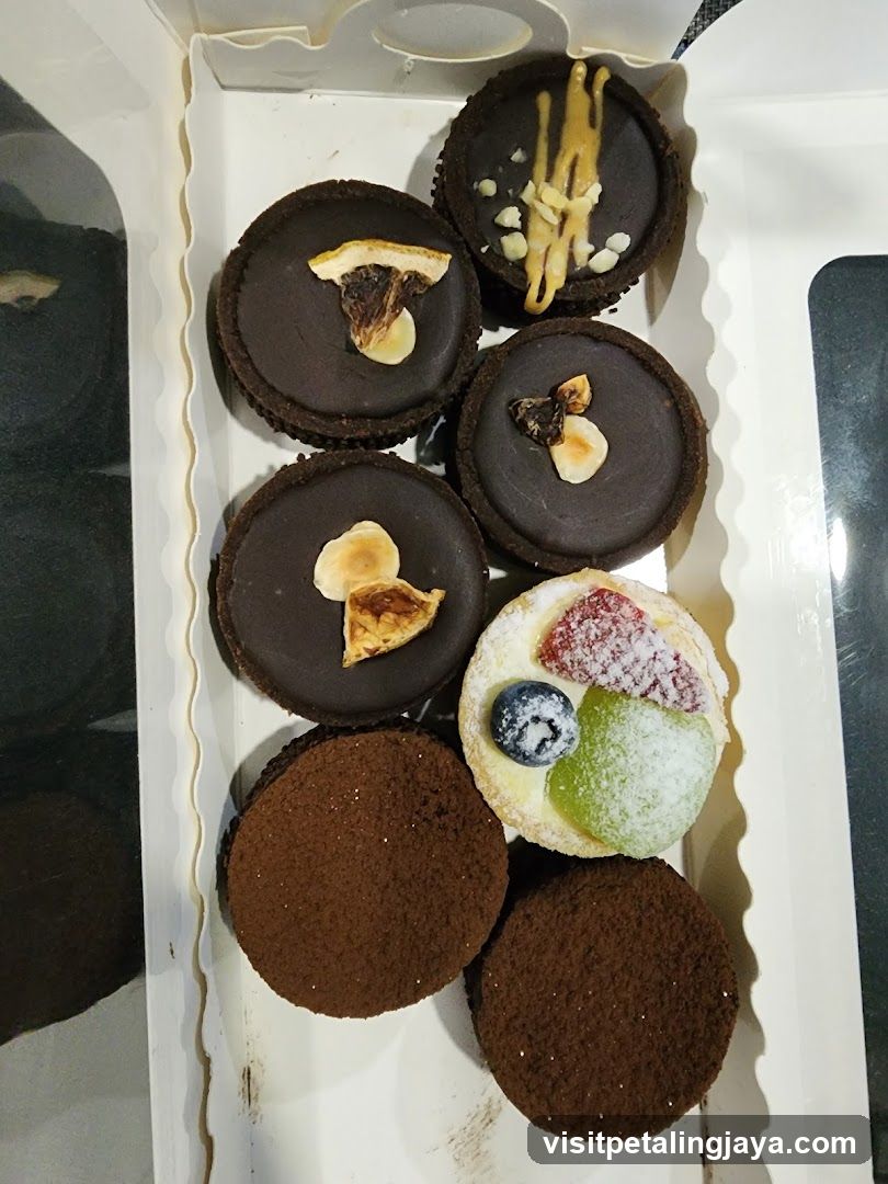 Assortment of Chocolate Tarts and Fruit Tart