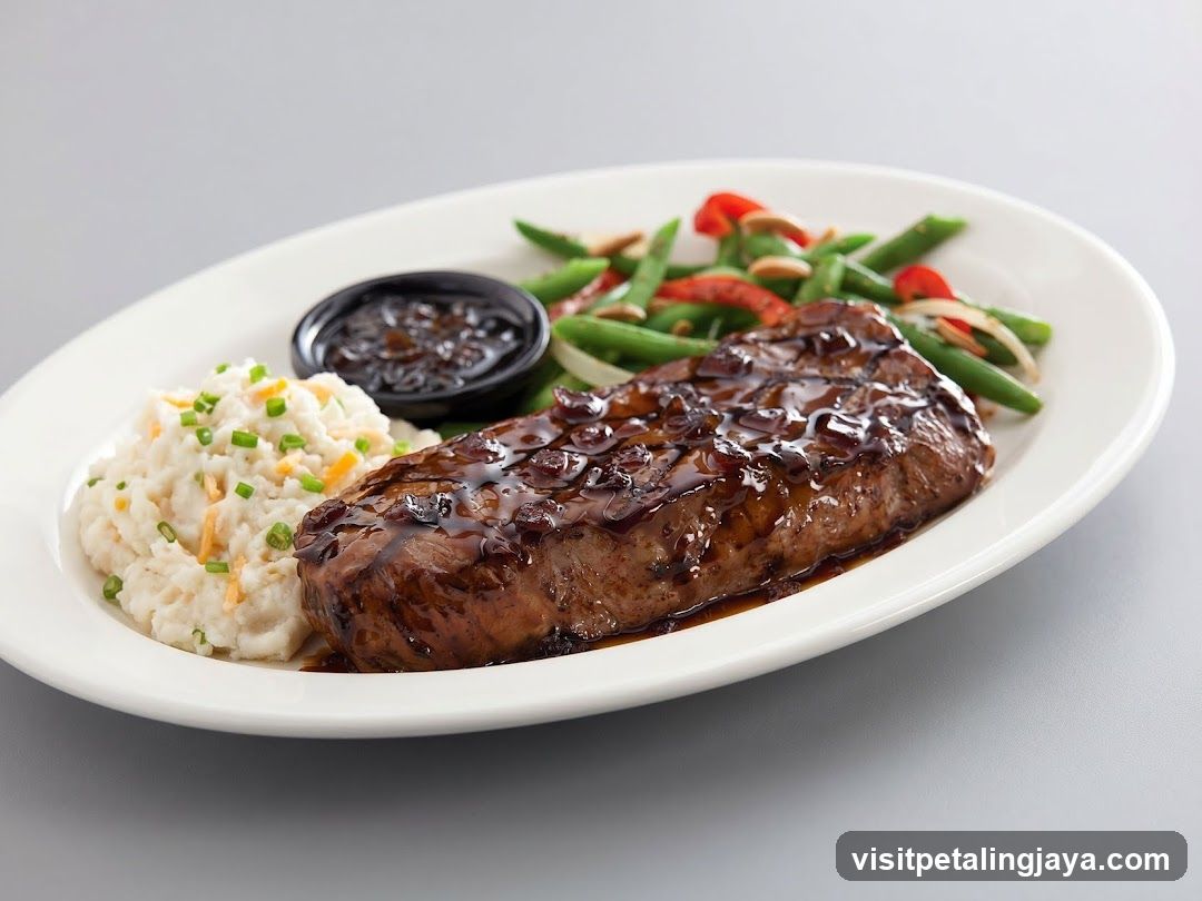 Sauced Steak with Mashed Potatoes and Green Beans