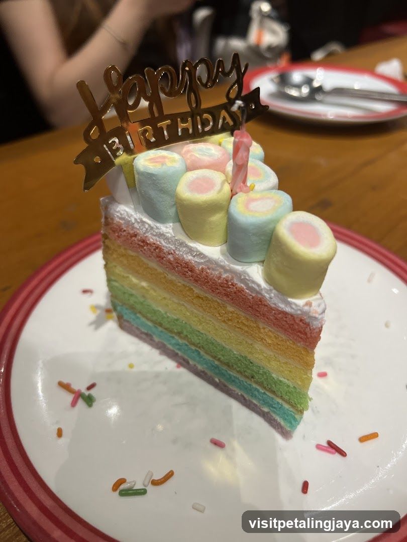 Rainbow Layer Cake Slice