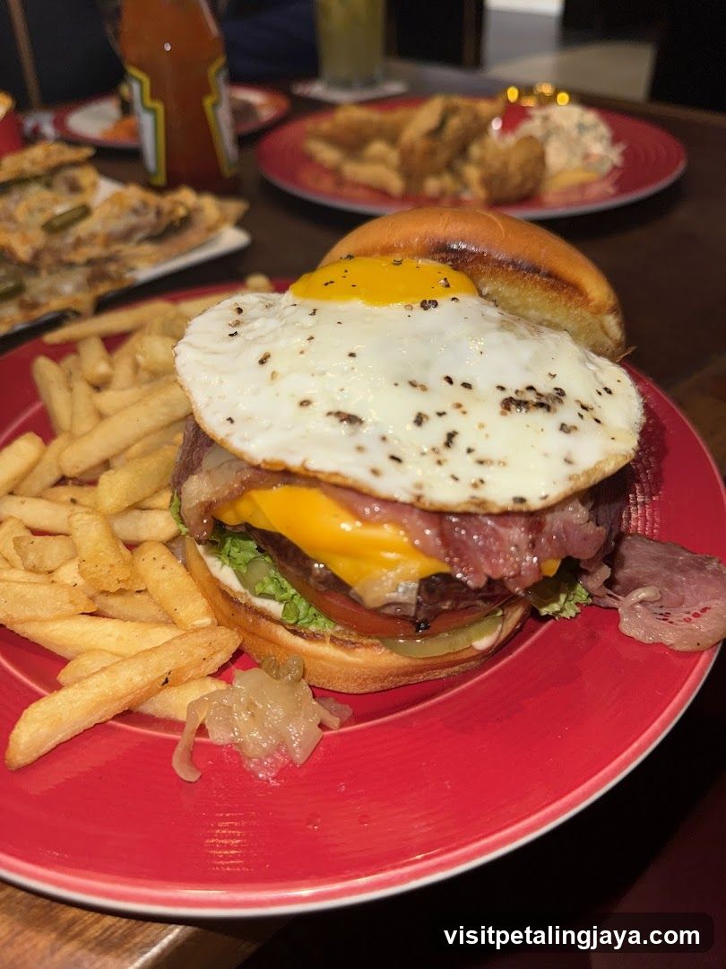 Loaded Burger with Fried Egg and Fries