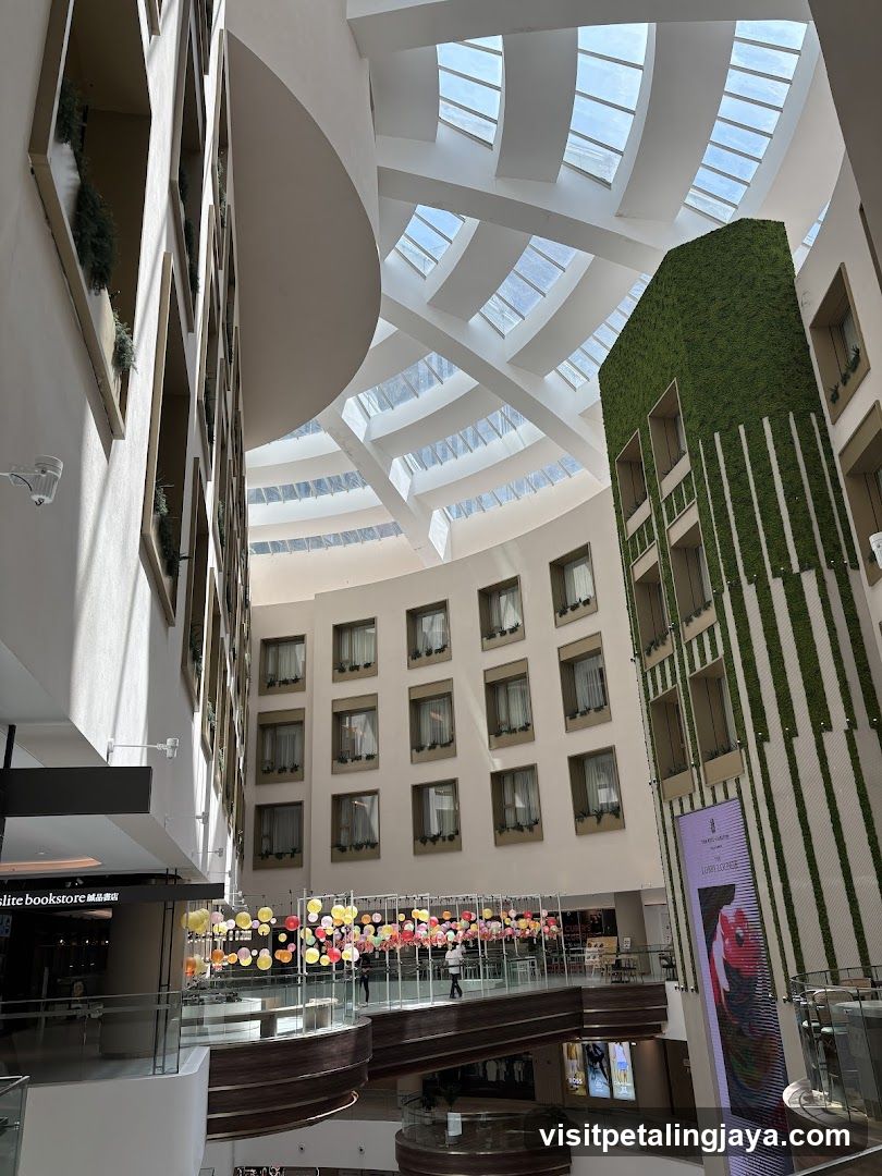 Interior atrium with green wall and skylights