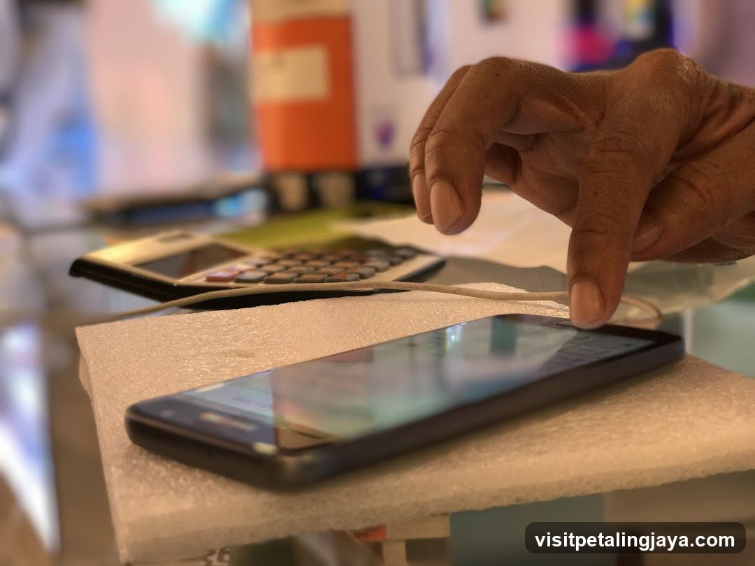 Hand interacting with smartphone on foam pad