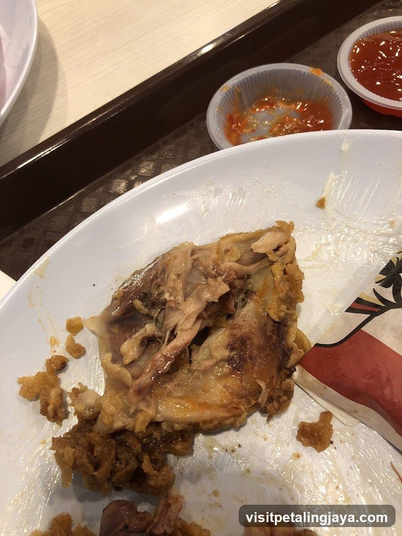 Eaten Chicken Dish on Plate