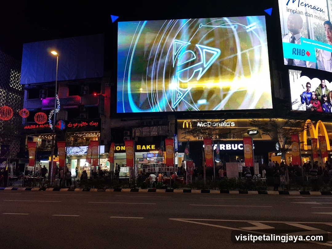 Night Street Scene with Billboards and Shops
