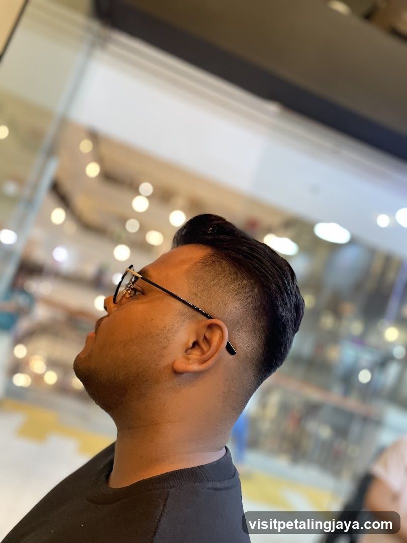 Man with modern haircut in mall interior
