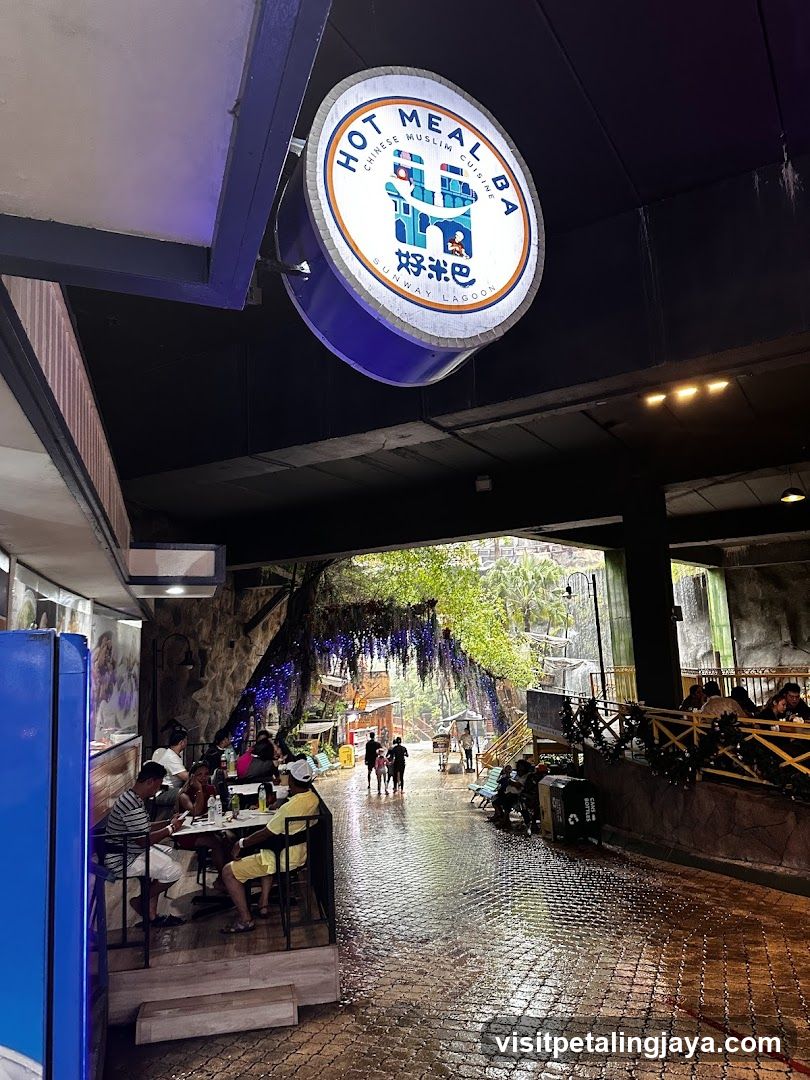 Outdoor dining area with a restaurant sign