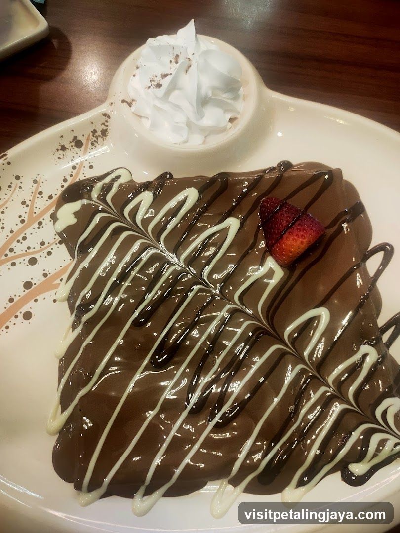 Chocolate Dessert with Whipped Cream and Strawberry