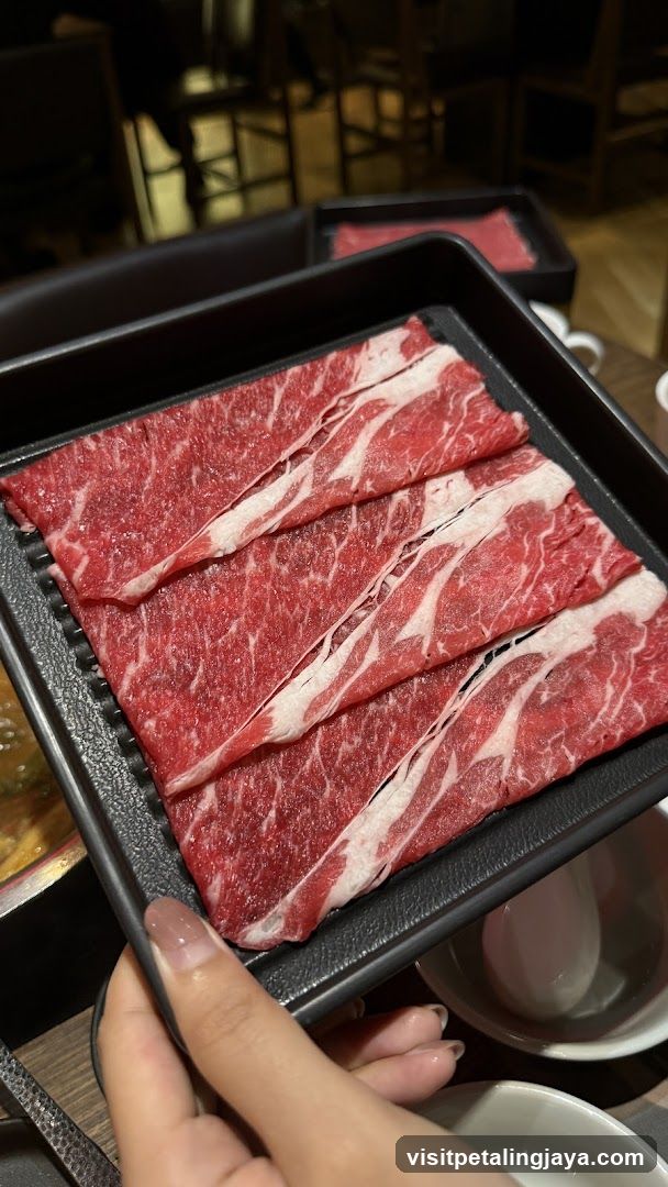 Raw Beef Slices on Black Tray
