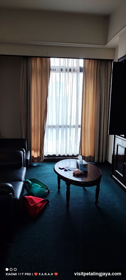 Hotel Room Interior with Coffee Table and Bags