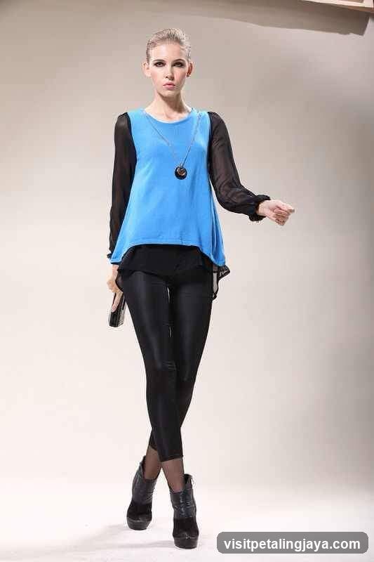 Woman in Blue and Black Outfit