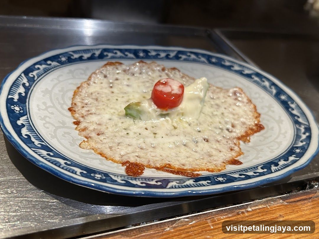 Cheese-covered dish with garnish