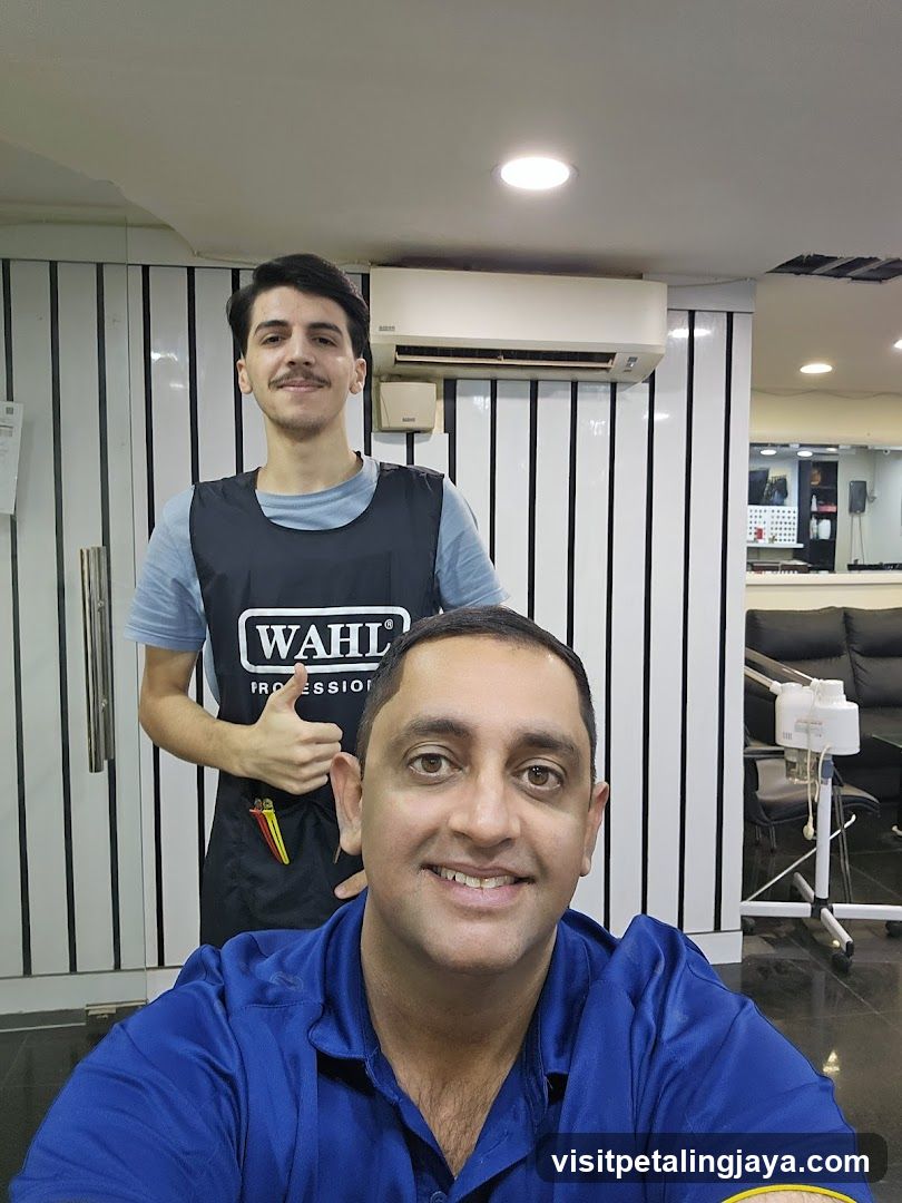 Barber Shop Interior with Staff and Customer