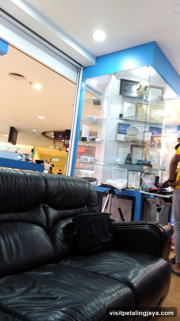 Interior of a shop with display case and seating area