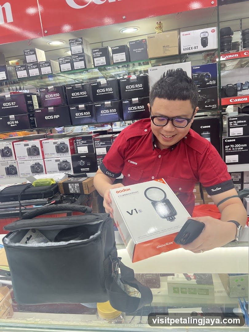 Canon Store Interior with Staff Displaying Product