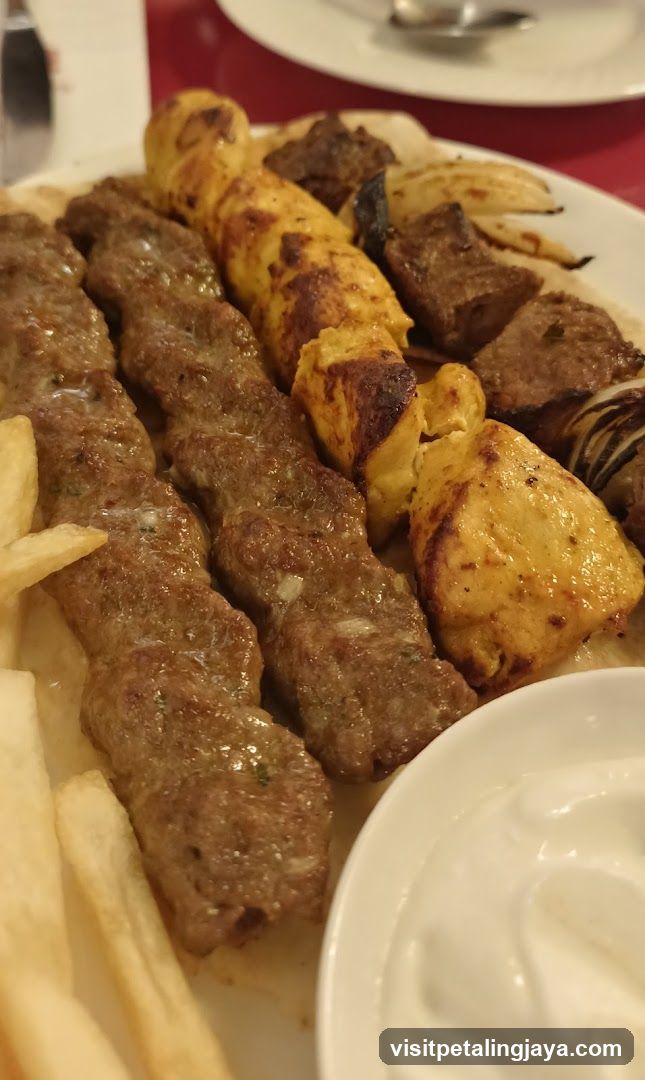 Grilled Meat Skewers and Fries