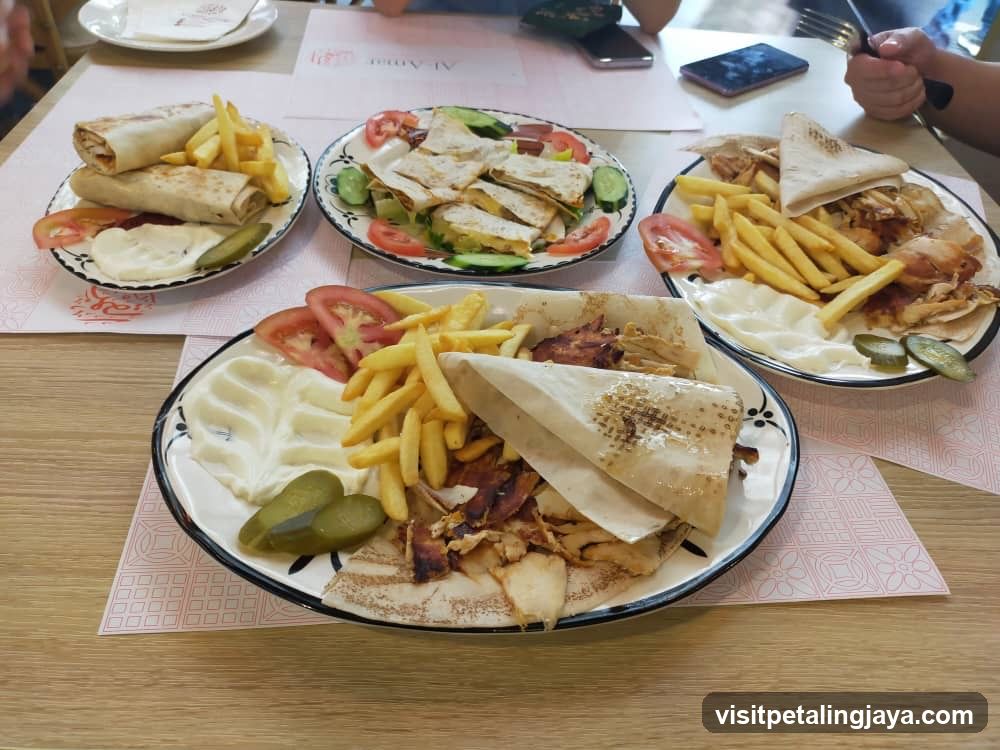 Table of Gyro Platters with Fries and Salad