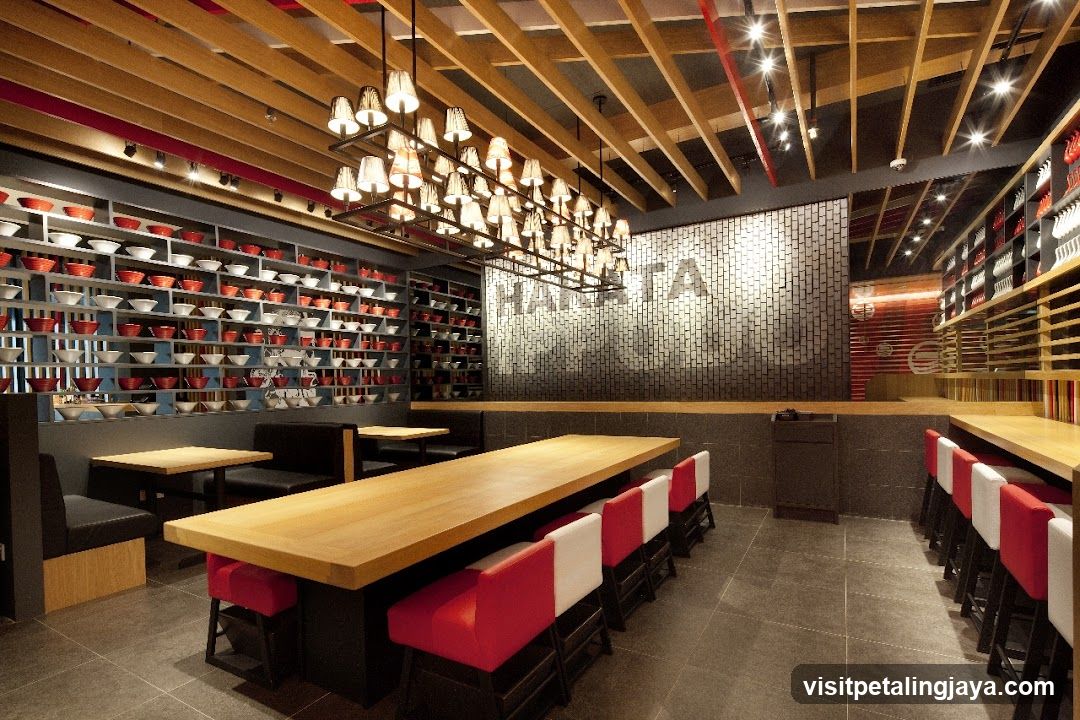 Restaurant Interior with Long Tables and Red Seating