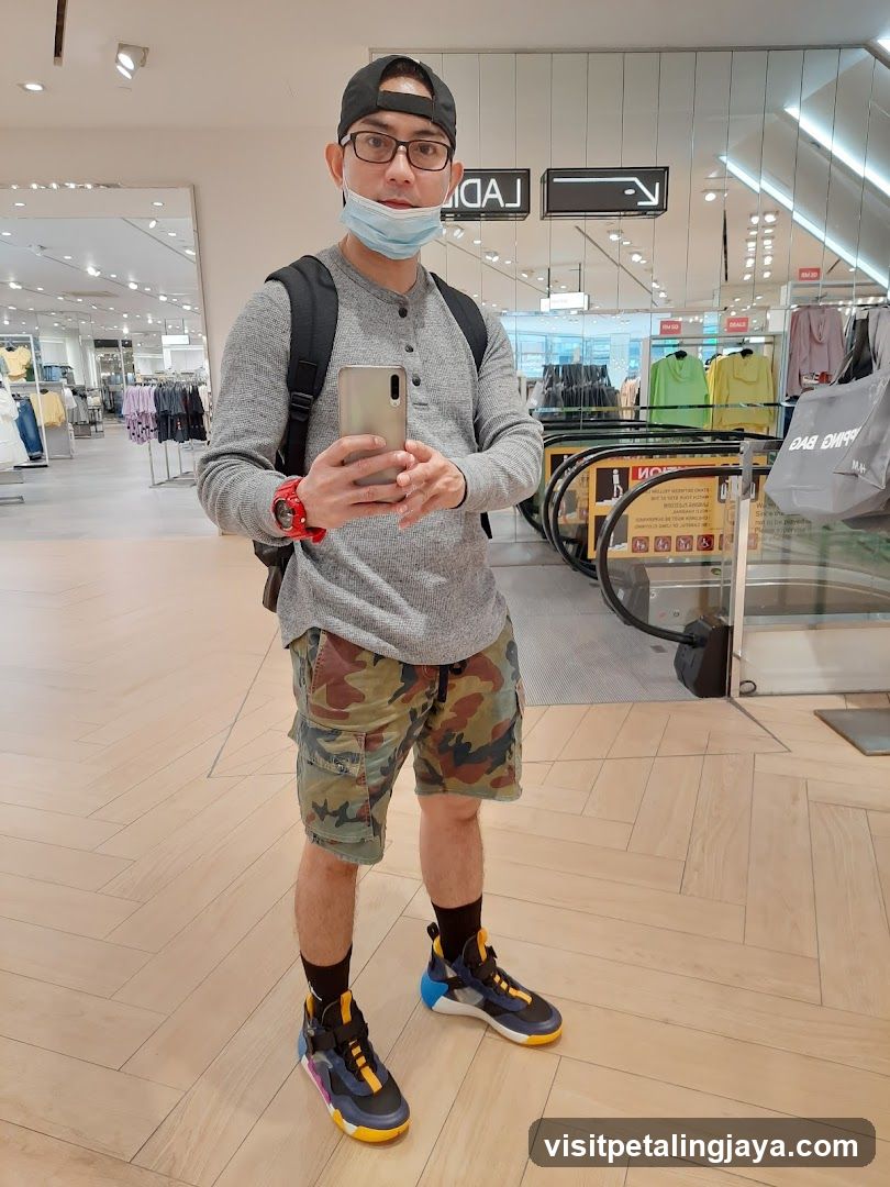 Man taking selfie in mall