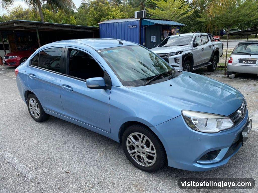 Light Blue Sedan in Parking Lot