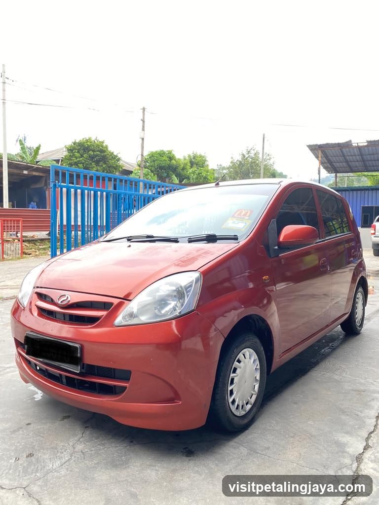 Red Toyota Yaris parked outside
