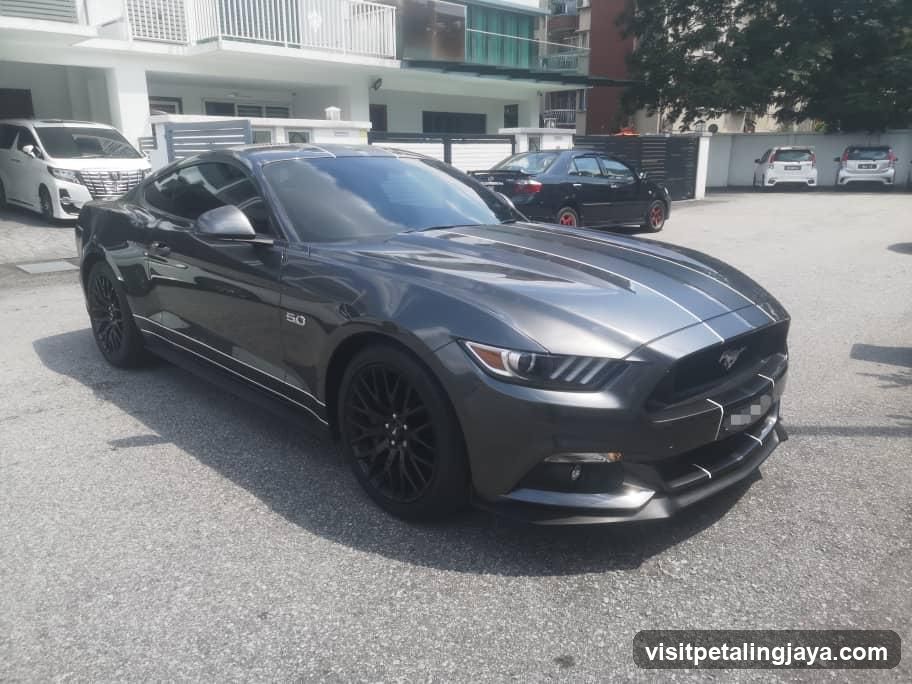 Gray Mustang in Parking Lot
