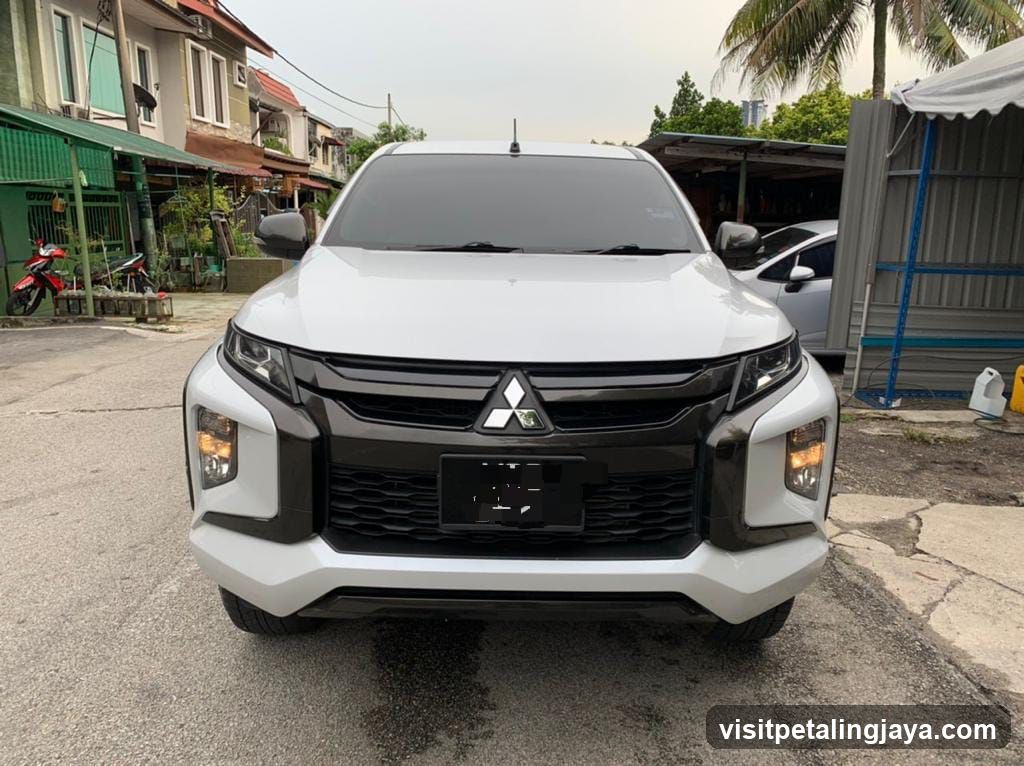 White Mitsubishi L200 Pickup Truck Front View