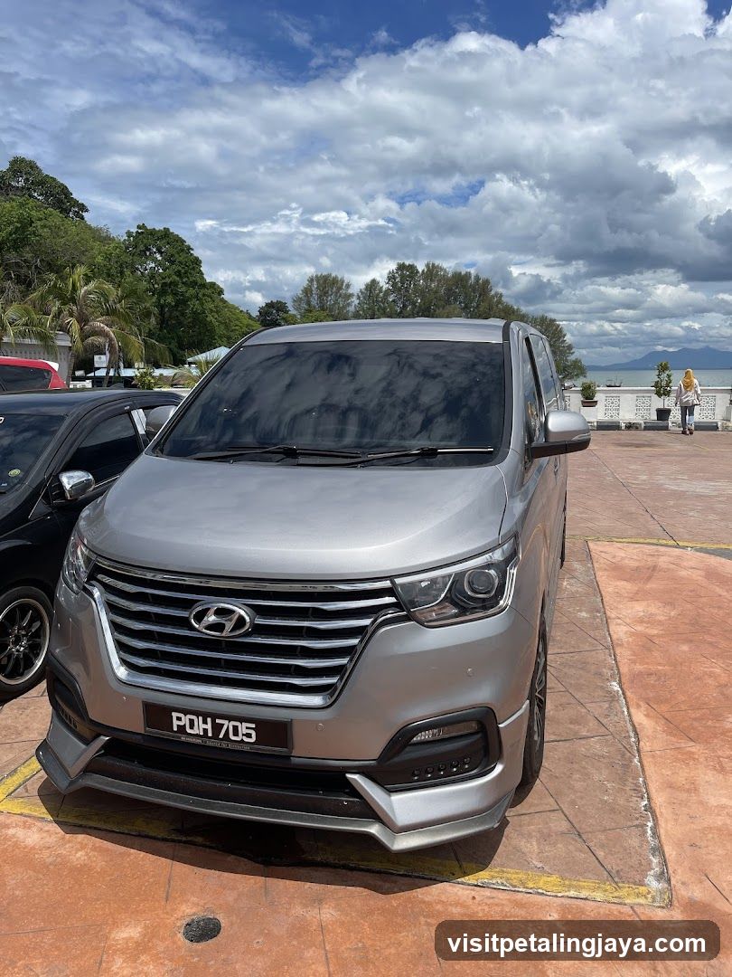 Silver Hyundai Van in Parking Lot