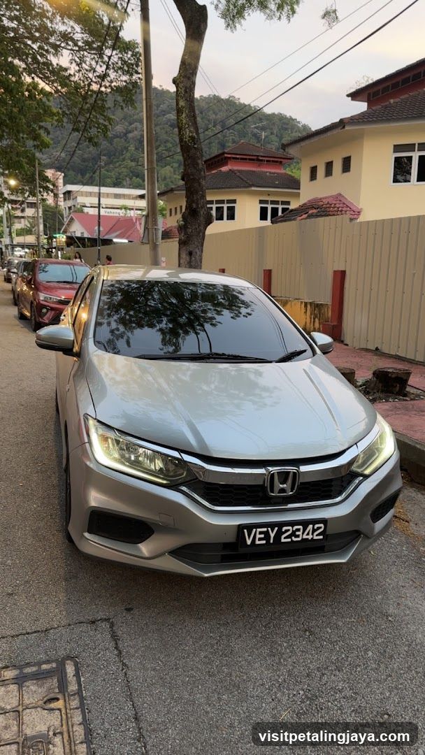 Silver Honda parked on street