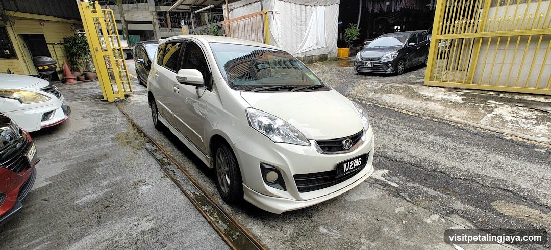 White MPV parked in lot