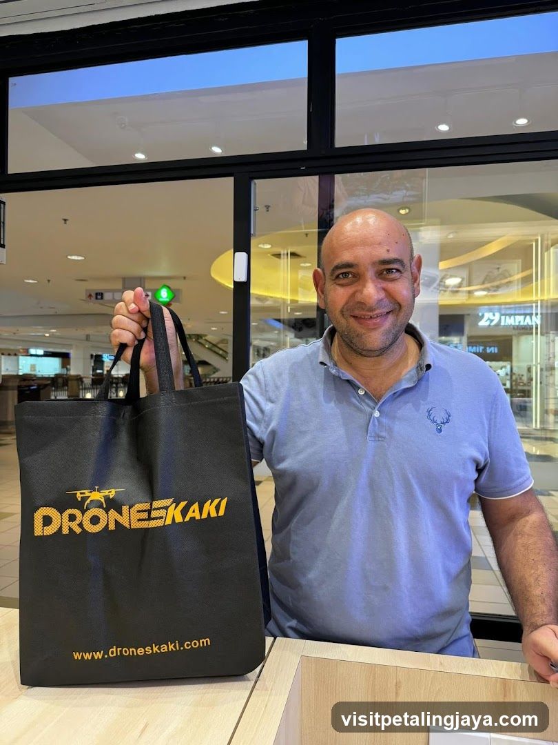 Man with Drone Shop Bag