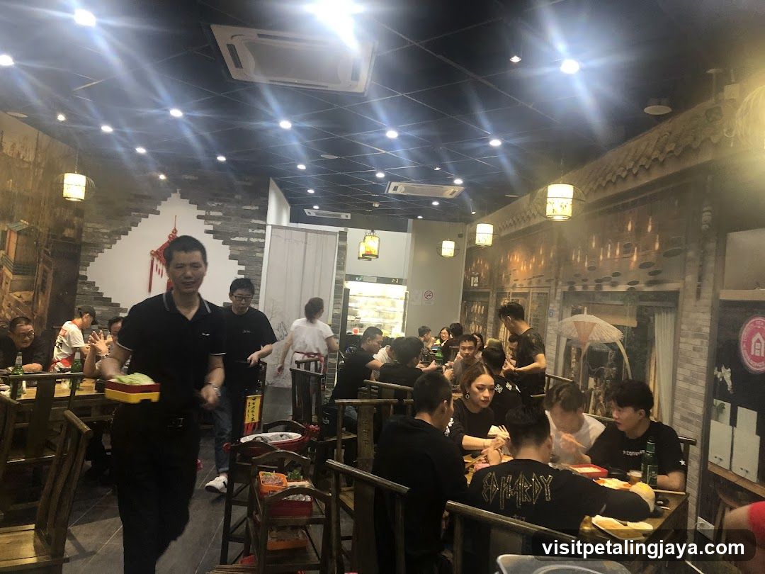 Dining Interior with Staff Serving Food