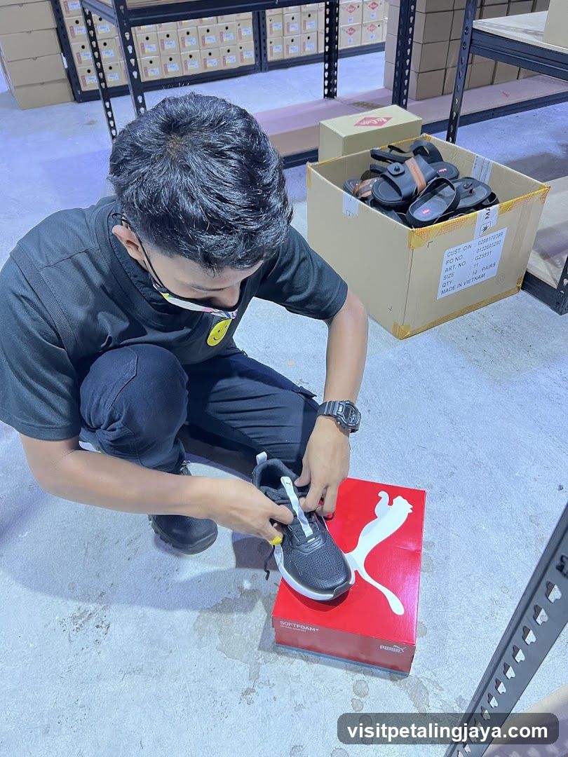 Worker Inspecting Shoes in Warehouse