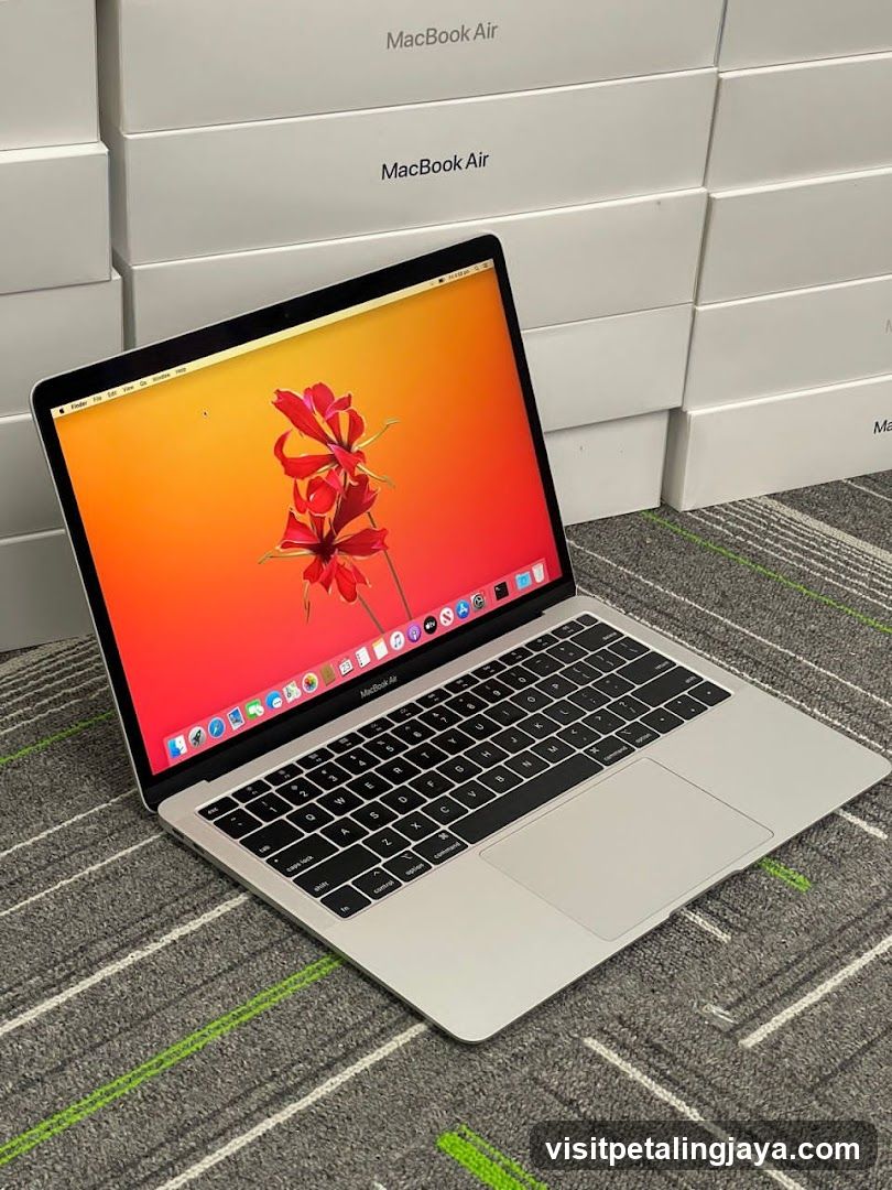 MacBook Air on display with boxes in background