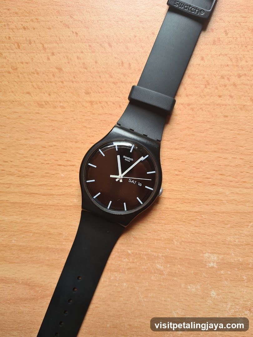 Swatch Watch on Wooden Surface
