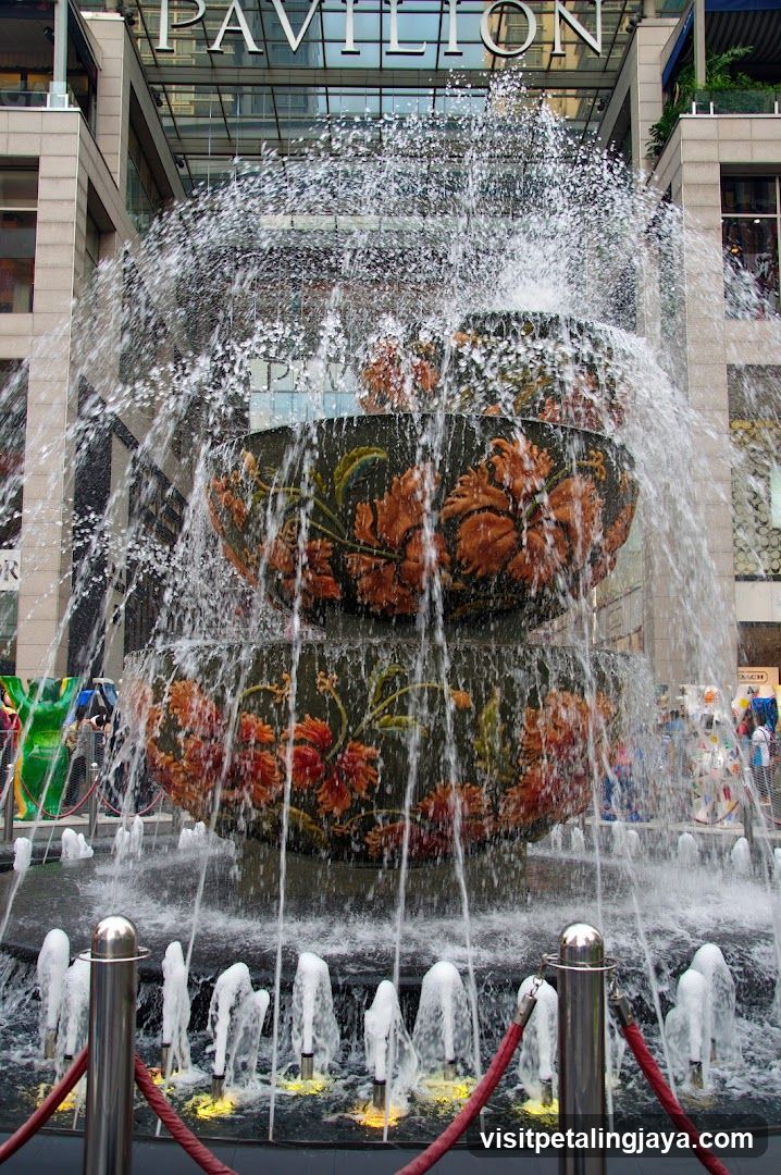 Fountain with floral patterns in urban plaza