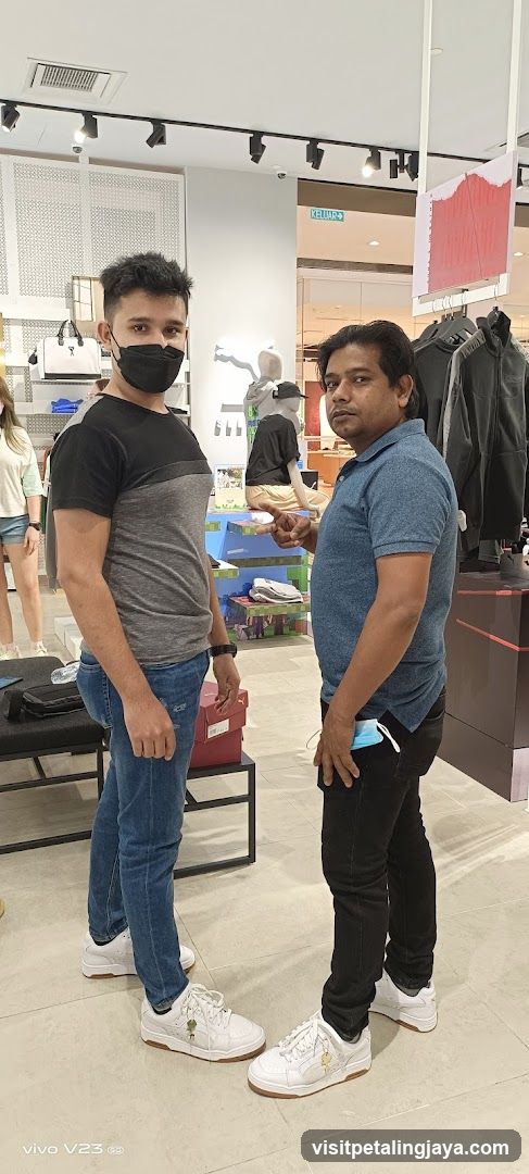 Two men in a clothing store interior