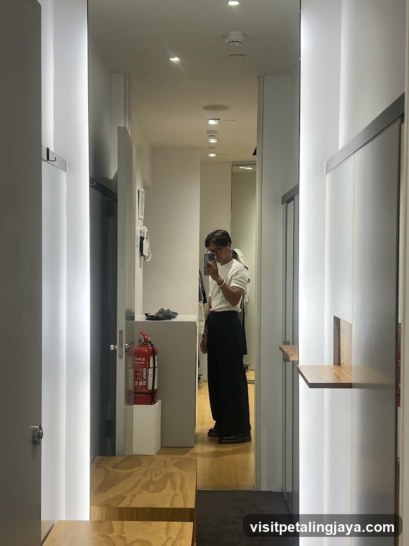 Interior hallway with person taking mirror selfie